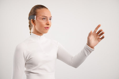 Young Woman Using Advanced Wearable Technology in Studio