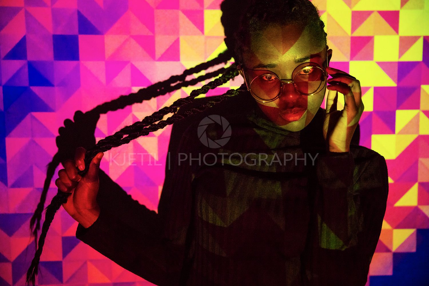 Creative colored pattern from projection light on beautiful women with dark skin