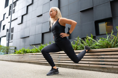 Close-up of Fit Woman Performing Lunge Workout Outdoor in the City