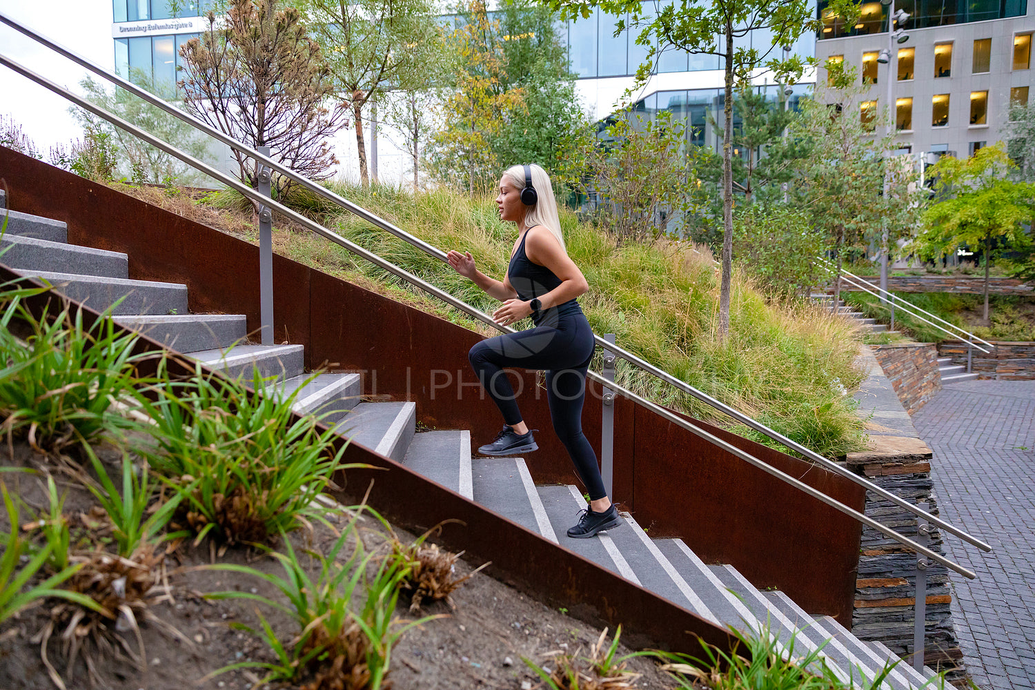 Fitness women running fast intervals in stairs in city park