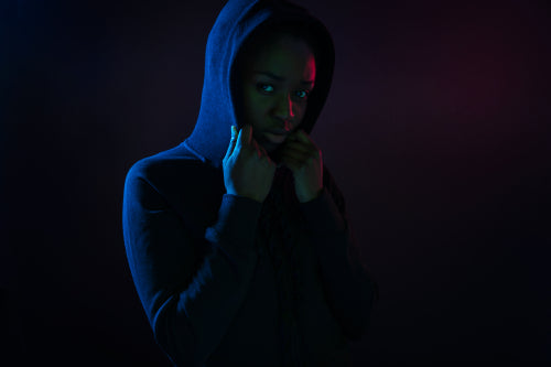 Colorful portrait of a cool black woman with dark skin wearing hoodie