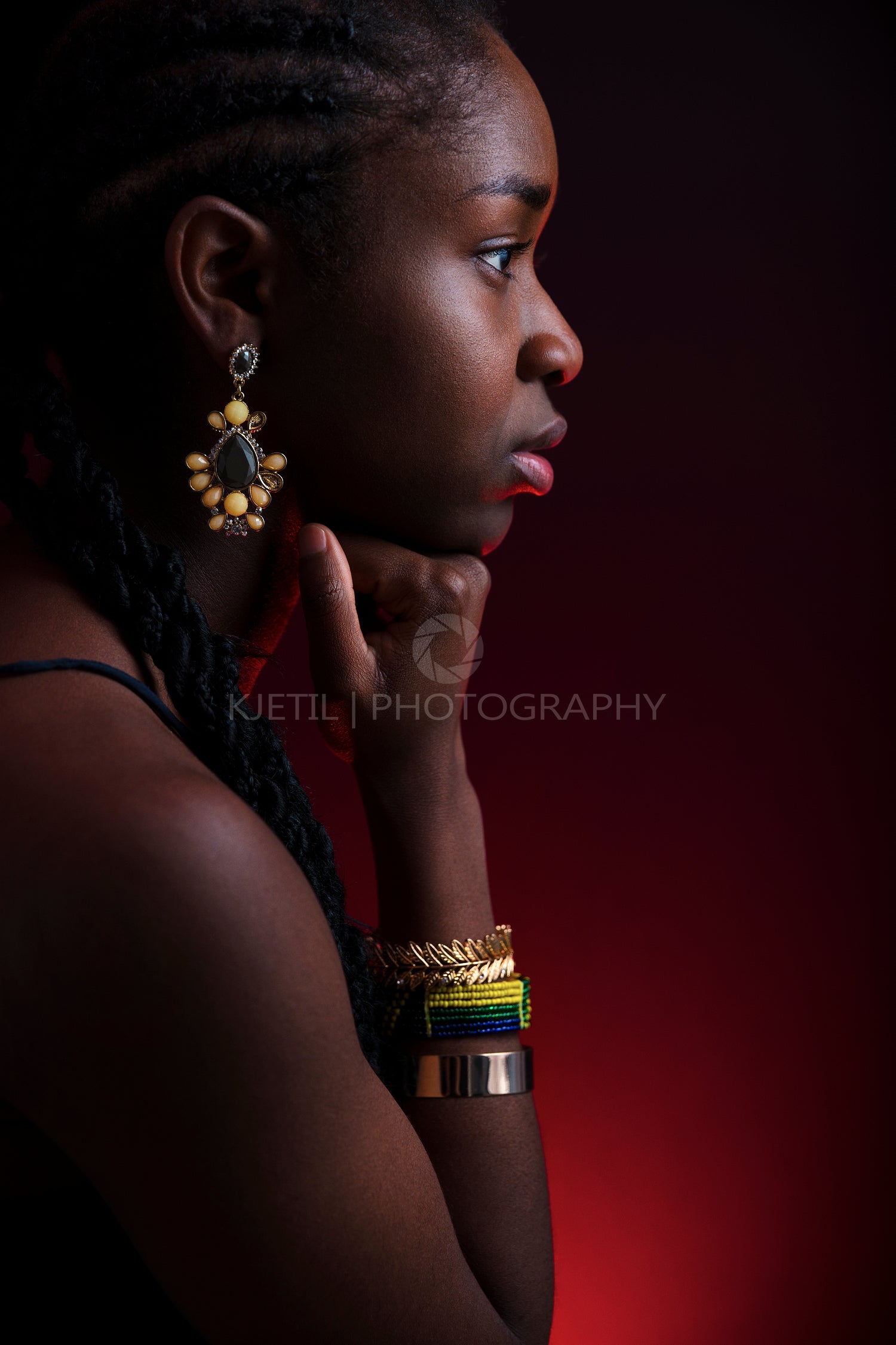 Colorful and creative side view portrait of african woman with dark skin