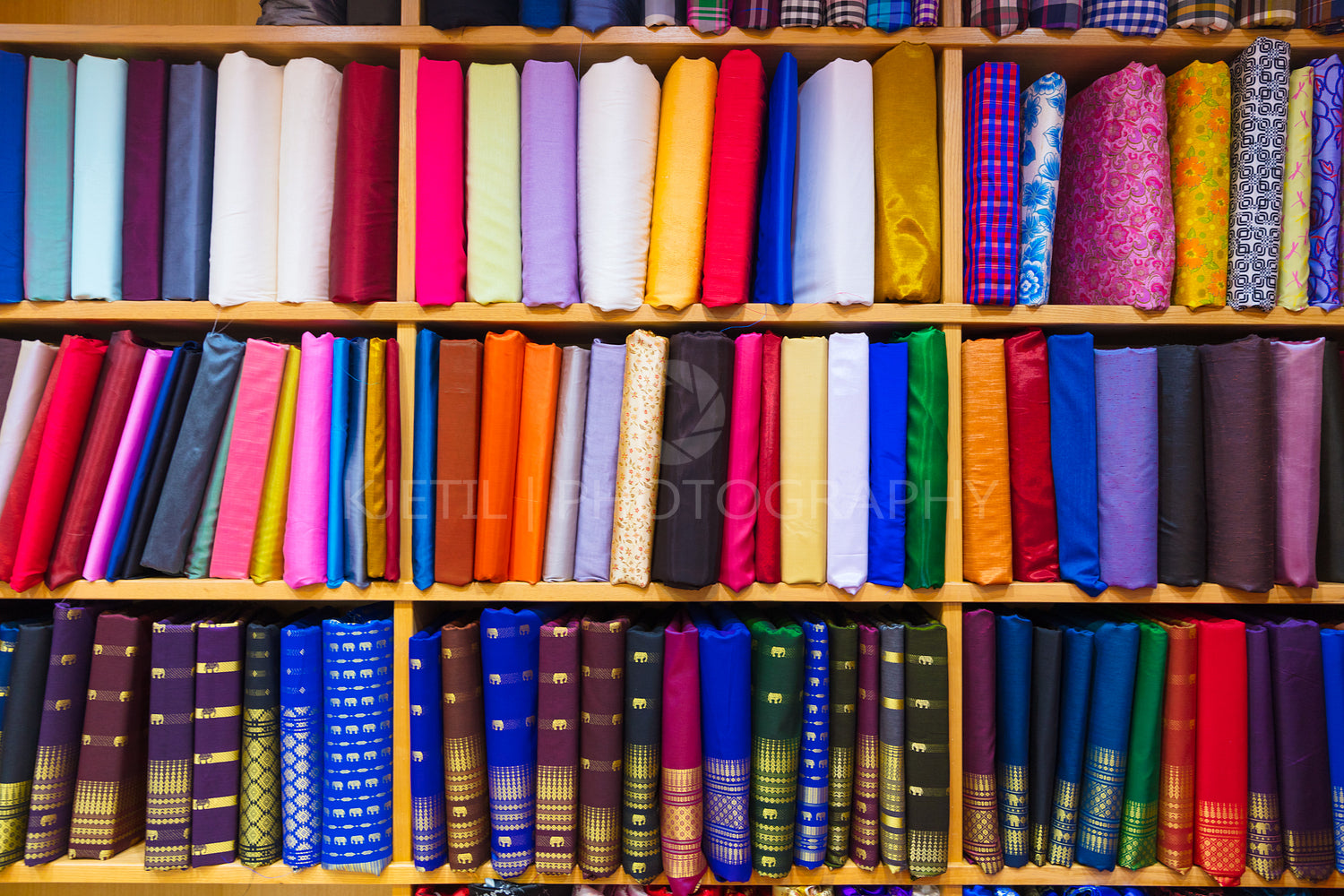 Colorful Fabrics Displayed In Shelves At Store