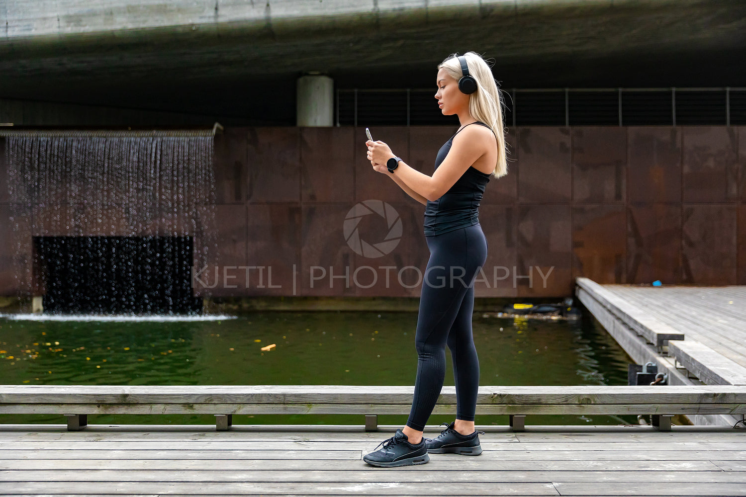 Woman runner prepare performance tracking on smartphone before running