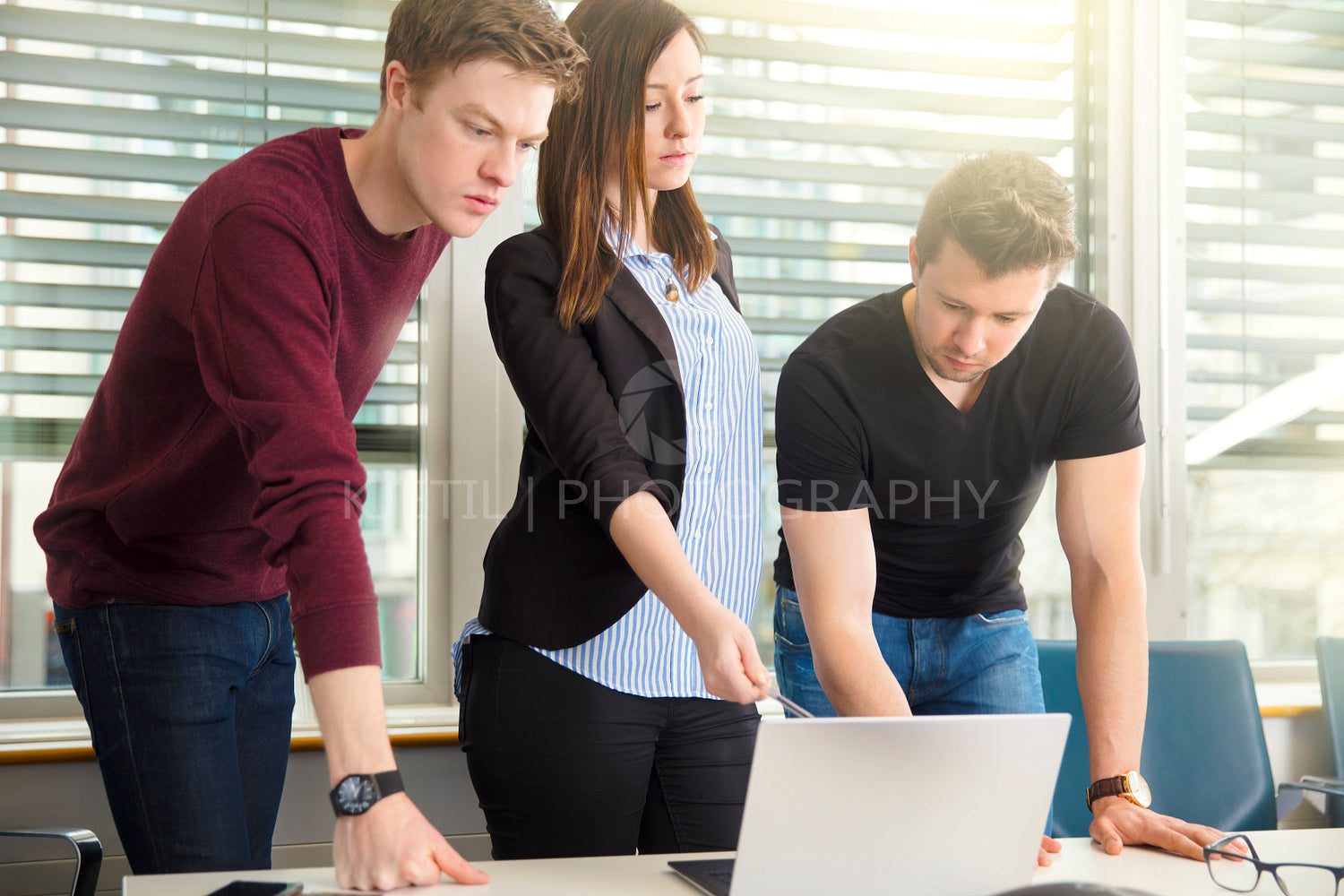 Business People Using Laptop In Office