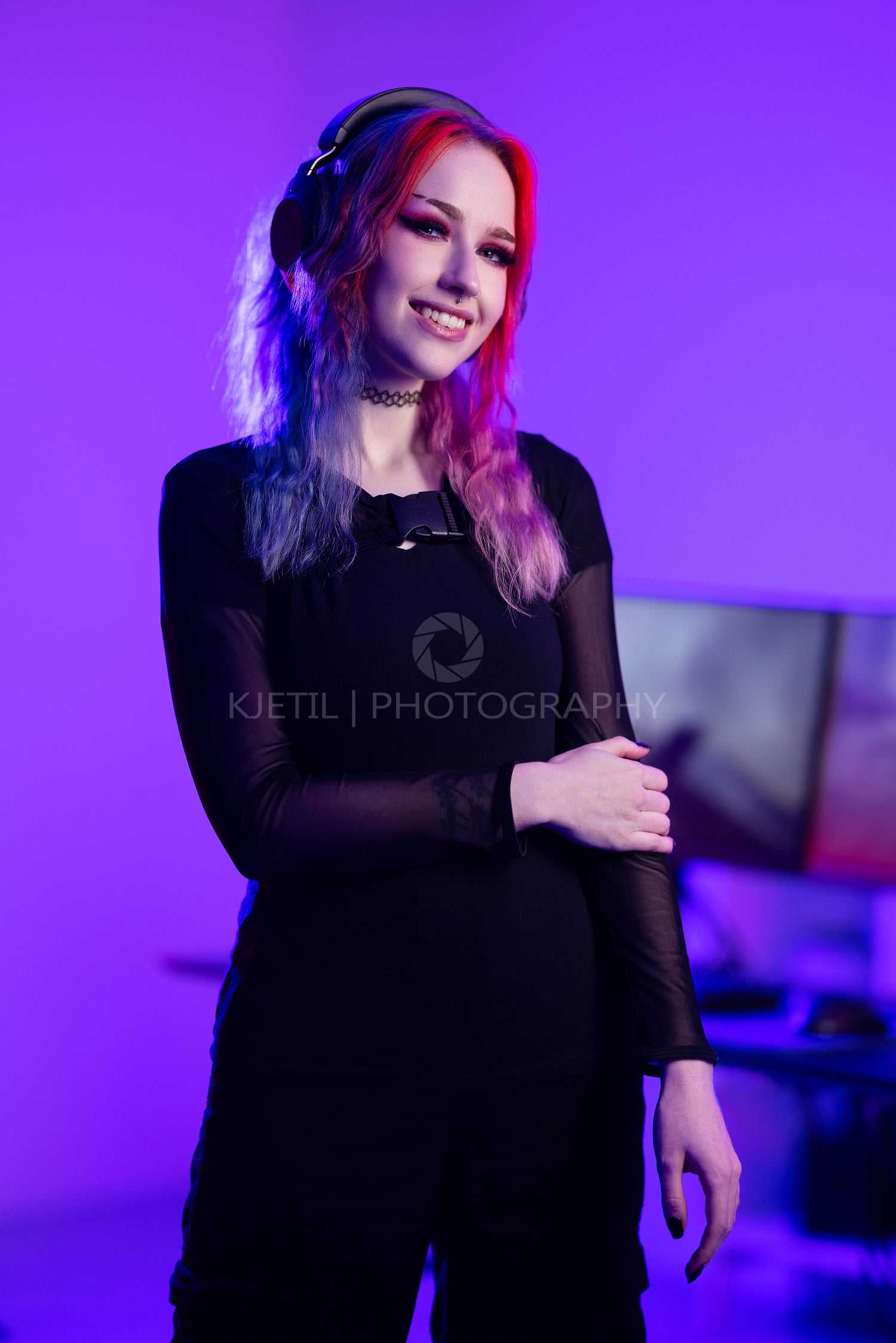 Gamer Girl At PC Smiling To Camera Sitting At Home Stock Photo by