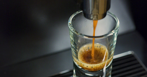 Close-up of strong espresso making at exclusive coffee machine