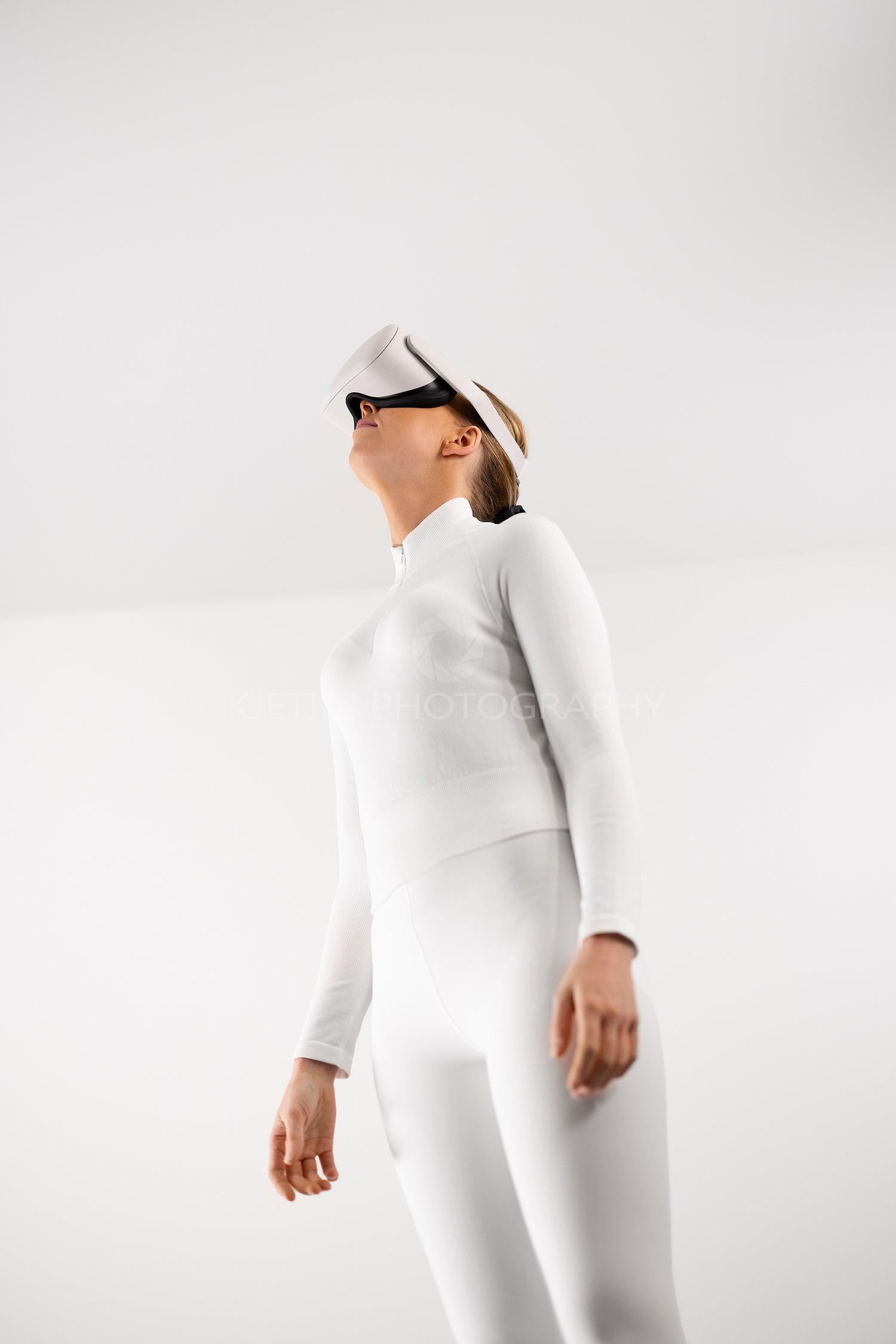 Woman Exploring Virtual Reality in Modern Minimalist Setting