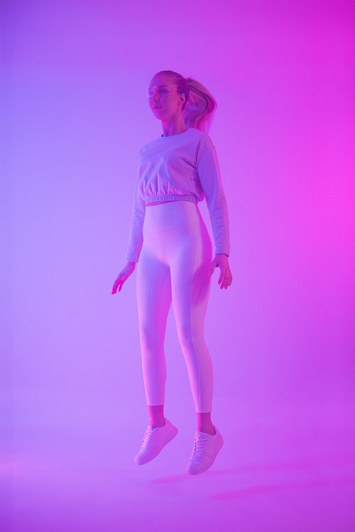 Stylish Woman Floating in Neon Light with Modern Vibe