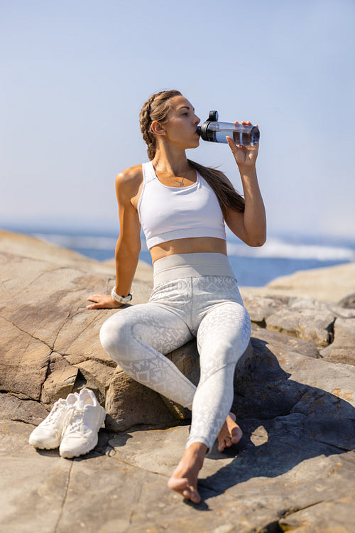 Fitness Enthusiast Hydrating During Outdoor Workout