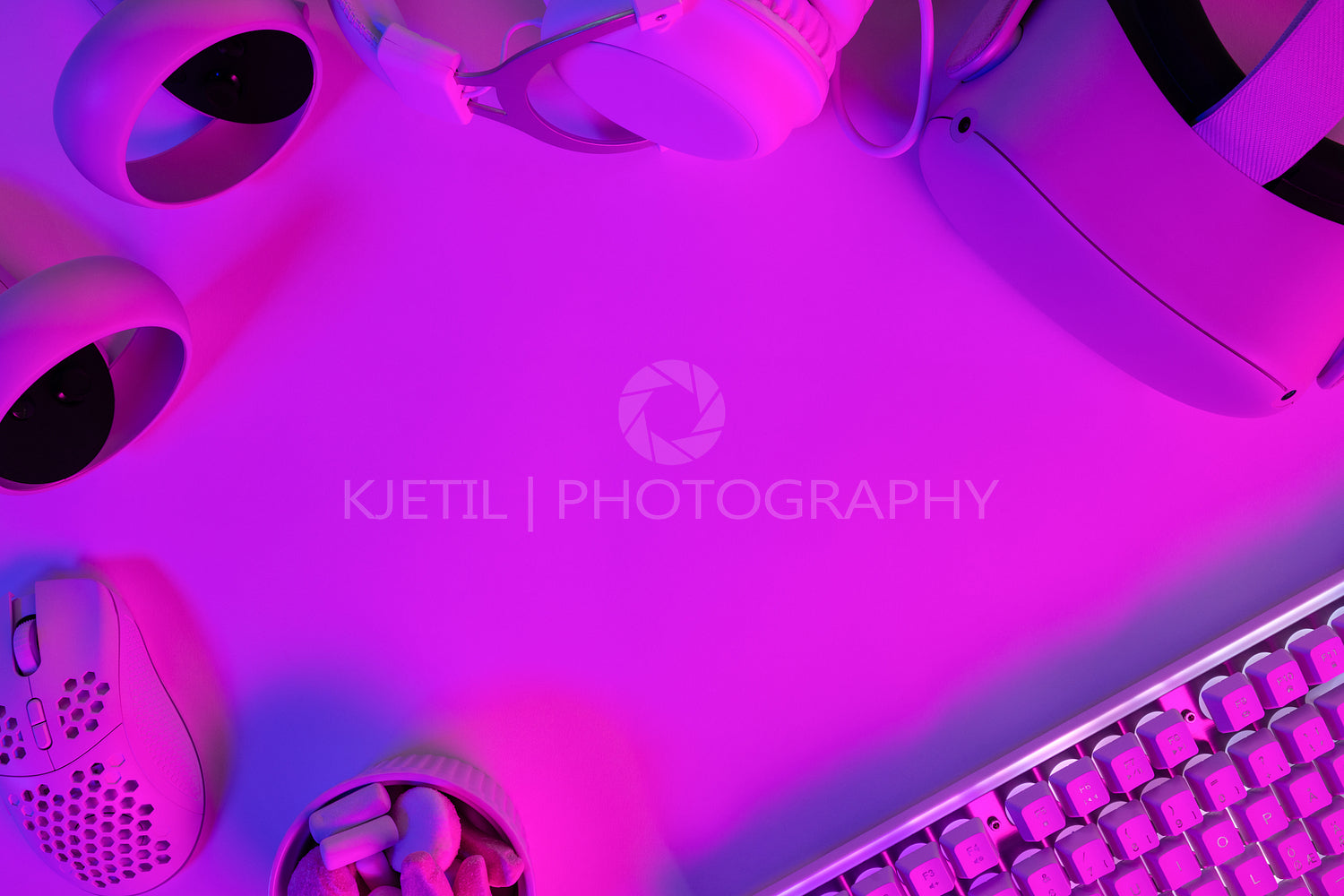 Modern gaming gadgets on purple desk