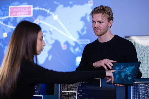 Cyber security teamwork in a Cyber Security Operations Center SOC to protect systems and technologies