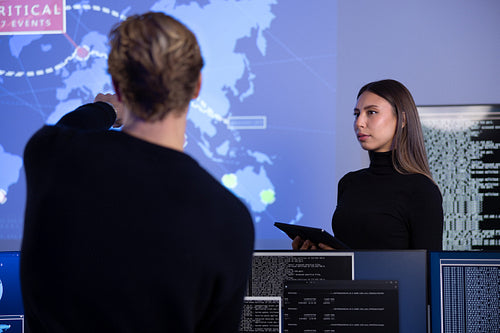 Cyber security team working in a Cyber Security Operations Center SOC to protect systems and technologies