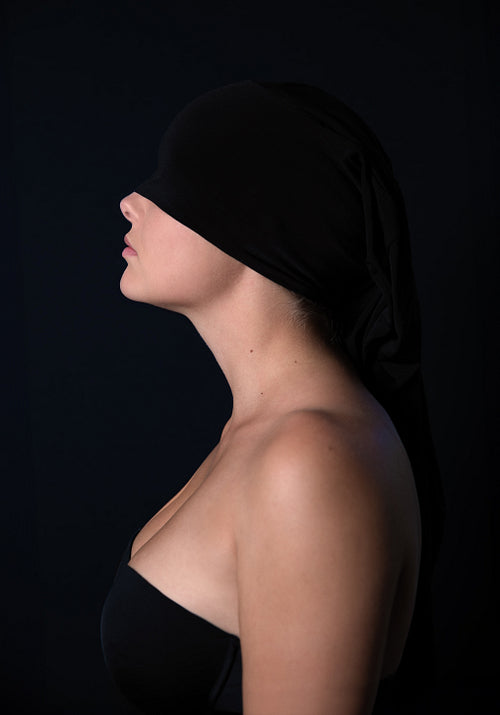 Abstract Portrait of Woman with Black Cloth on Dark Background
