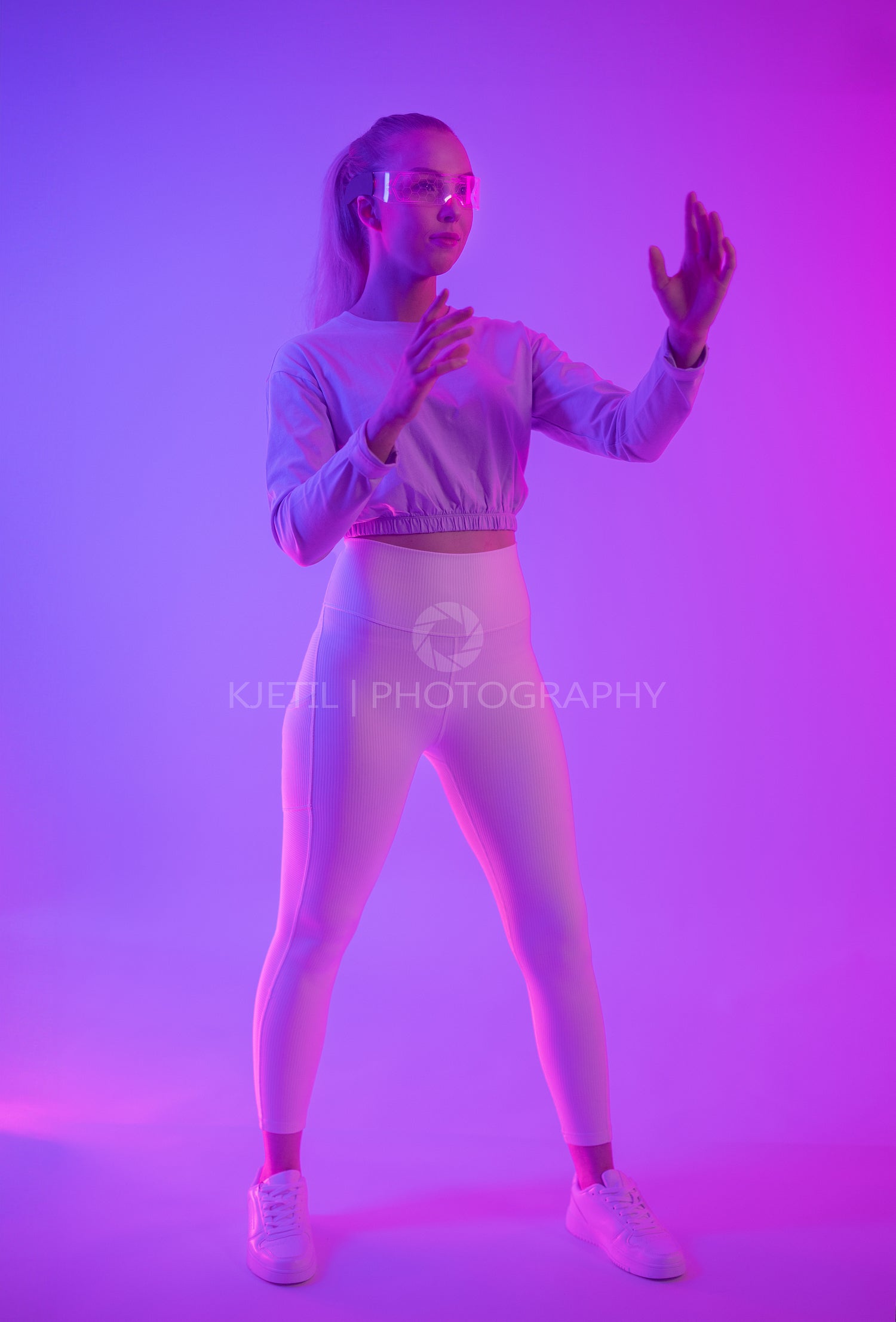 Young woman explores virtual reality in dynamic neon lighting