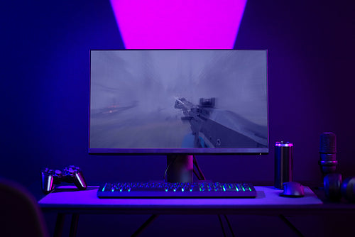 Modern gaming setup with colorful lighting and essential accessories