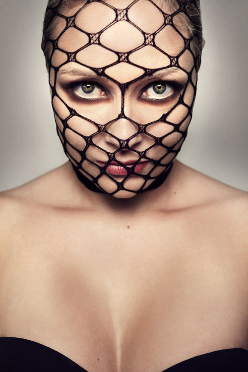 Beautiful Blonde Woman With Black Mesh On Her Face