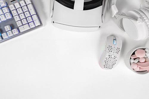 Gaming gadgets and marshmallows on desk