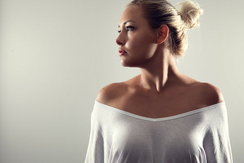 Studio portrait of gorgeous woman with blonde hair and white t-shirt