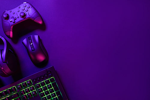 Gaming gadgets under pink light