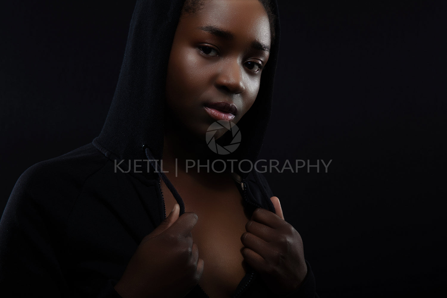 Confident and beautiful woman with dark skin and attitude wearing hoodie