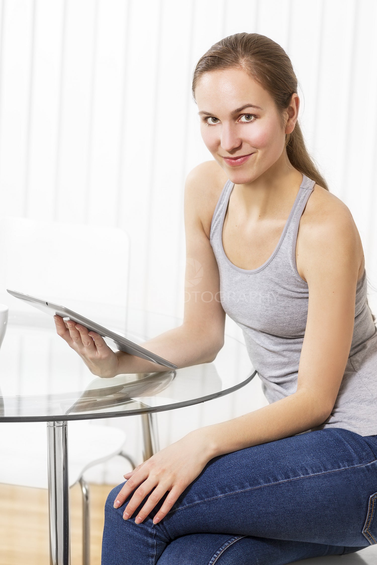 Woman use tablet in the kitchen