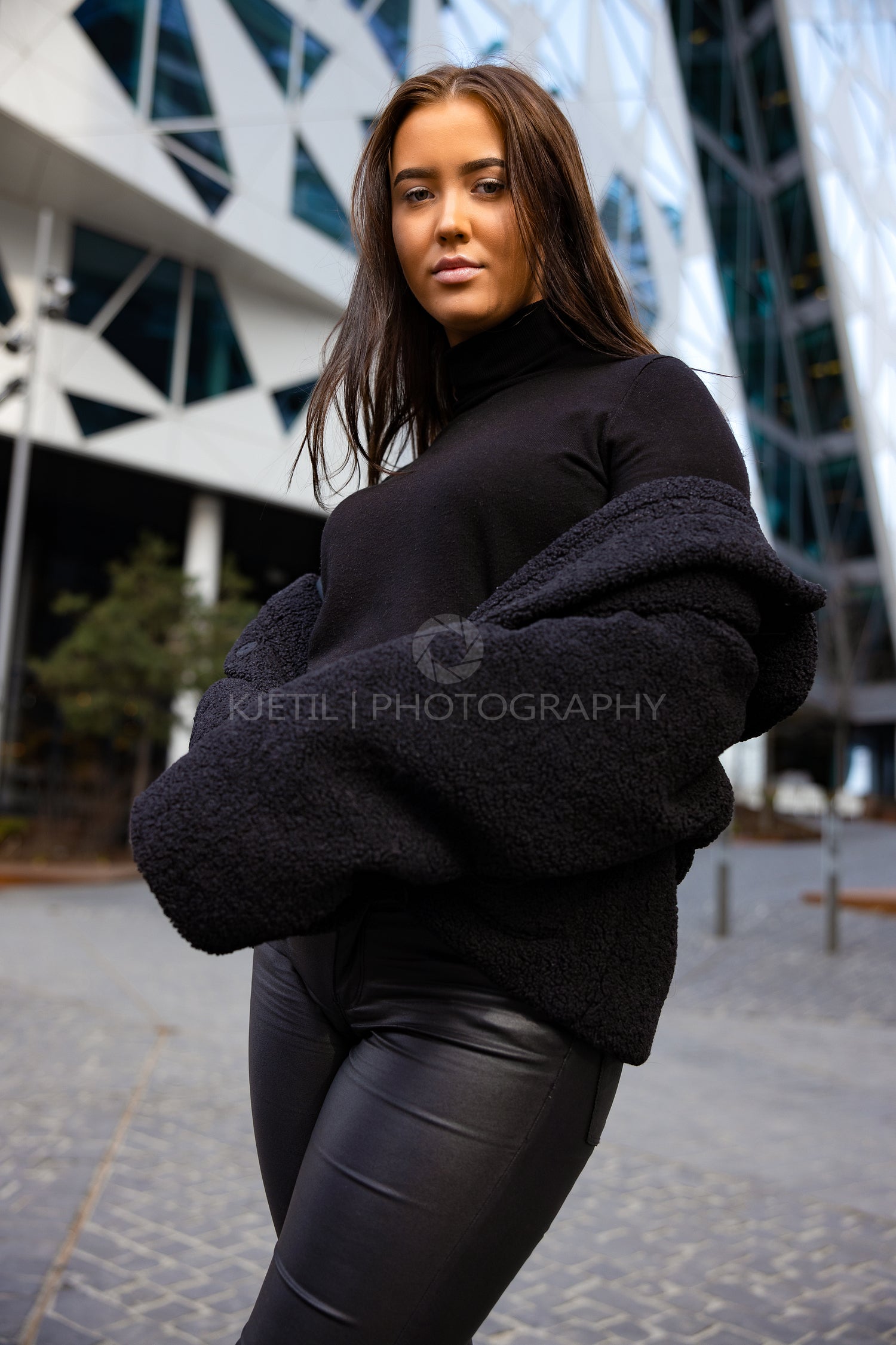 Environmental Portrait Of Attractive Young Woman In City