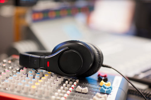 Headphones on Sound Mixer In Professional Radio Studio