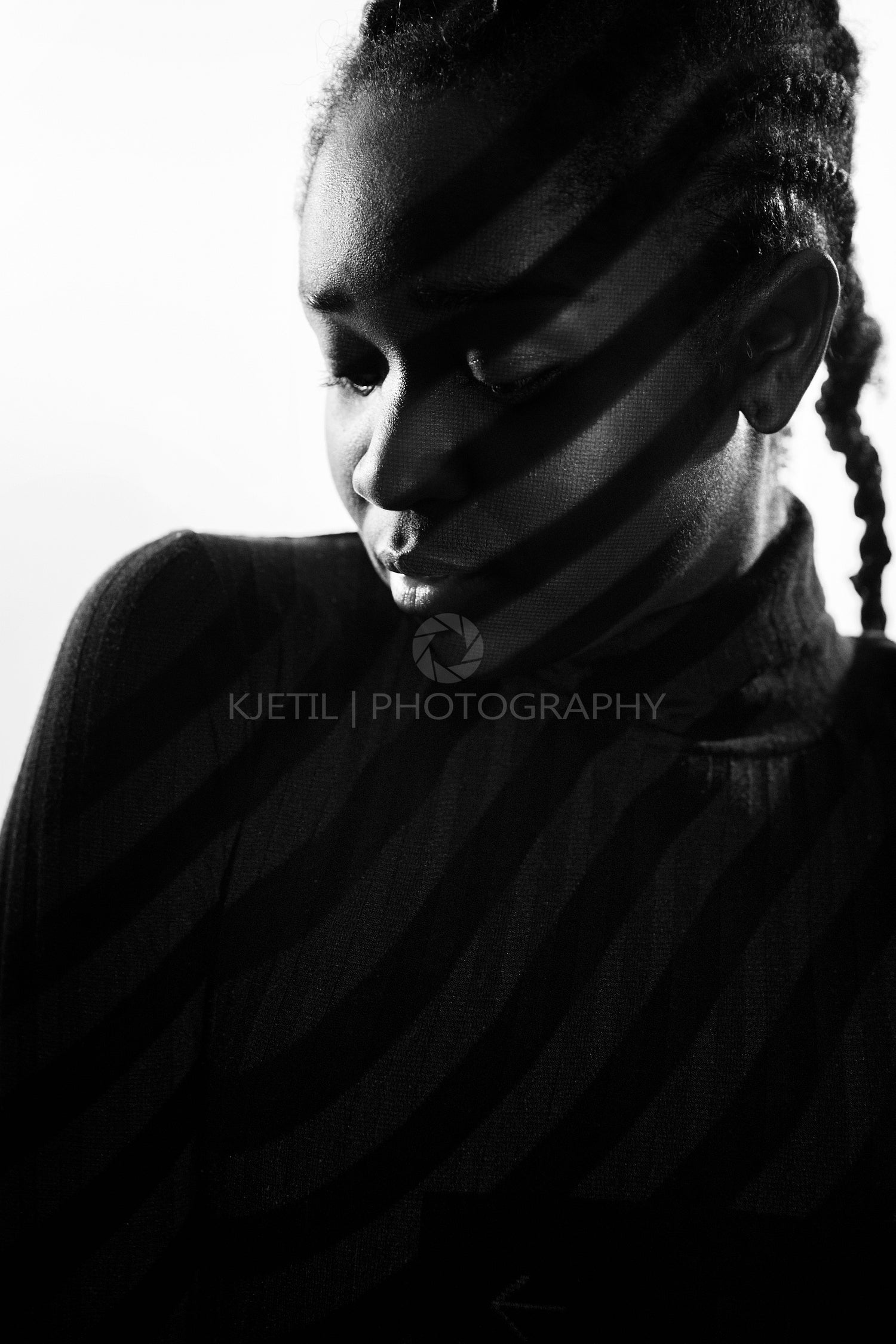 Creative light stripes from a projection on beautiful woman with dark skin