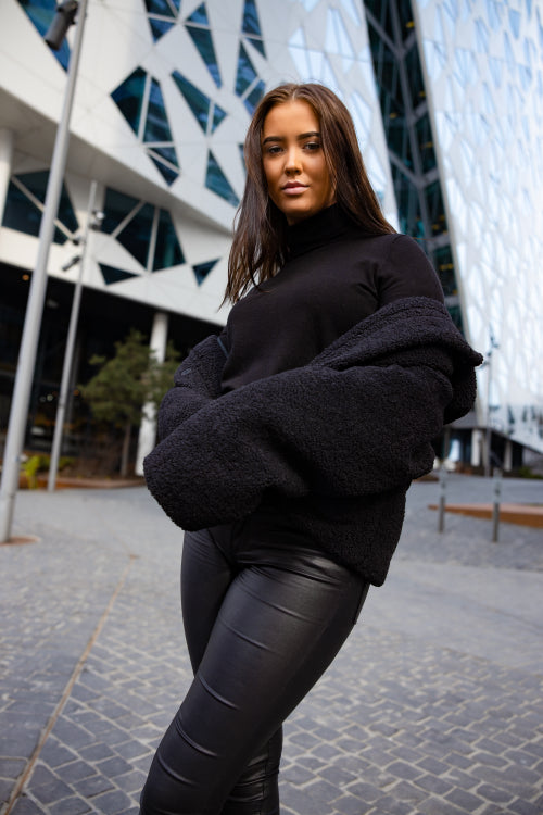 Outdoor Portrait Of Attractive Young Woman Wearing Black In City
