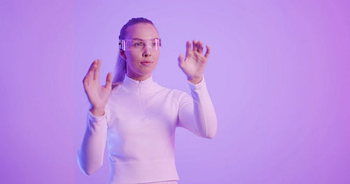 Woman in Augmented Reality Glasses in front of colored background