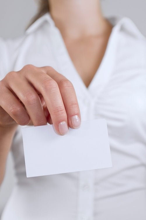 Woman Holding Business Card