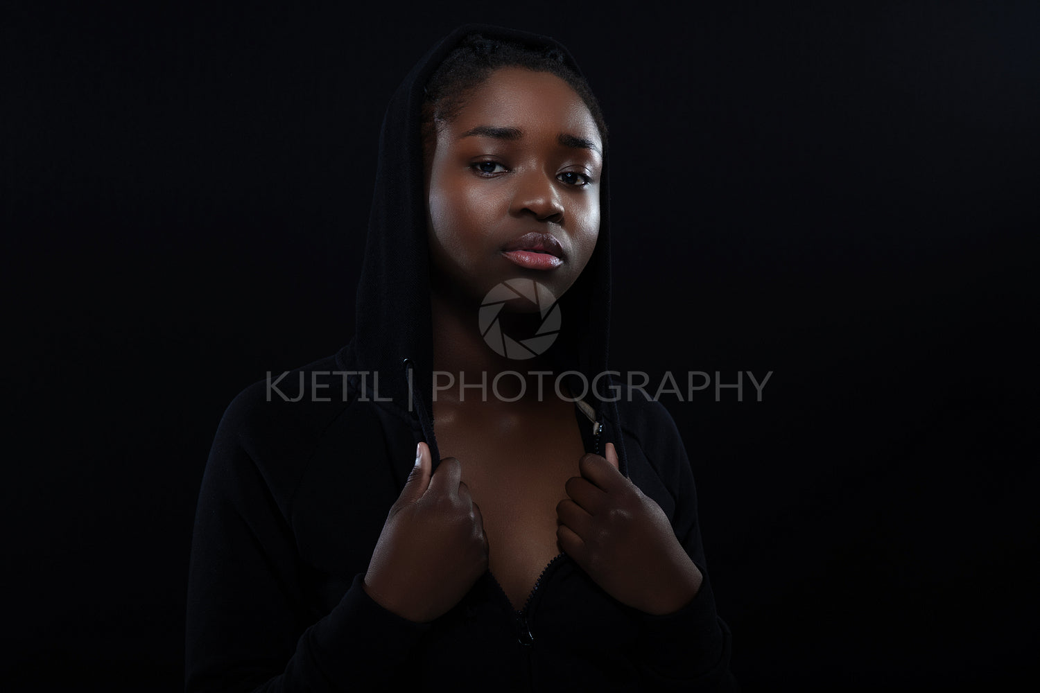 Confident woman with dark skin and cool attitude wearing hoodie