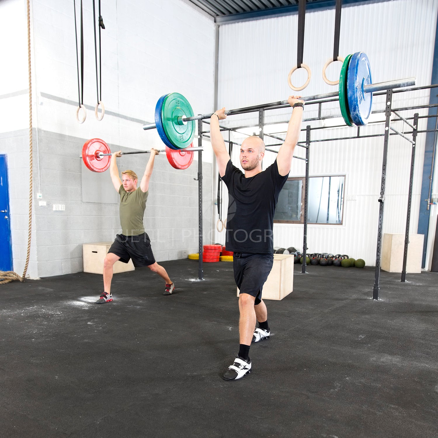 Clean and jerk workout at fitness gym center