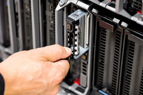 IT Engineer's Hands Repairing Server At Data Center