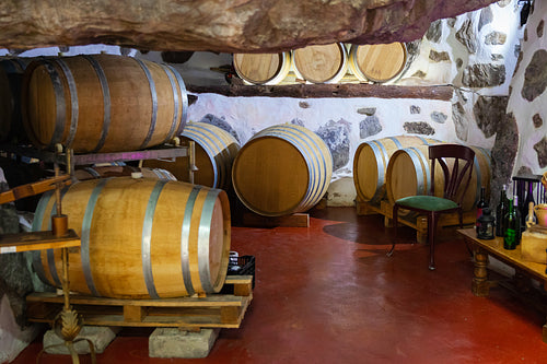 Wooden Barrels in oak Stored At Wine Cellar