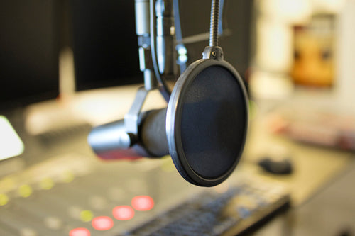 Close-up of a microphone in radio station broadcasting studio