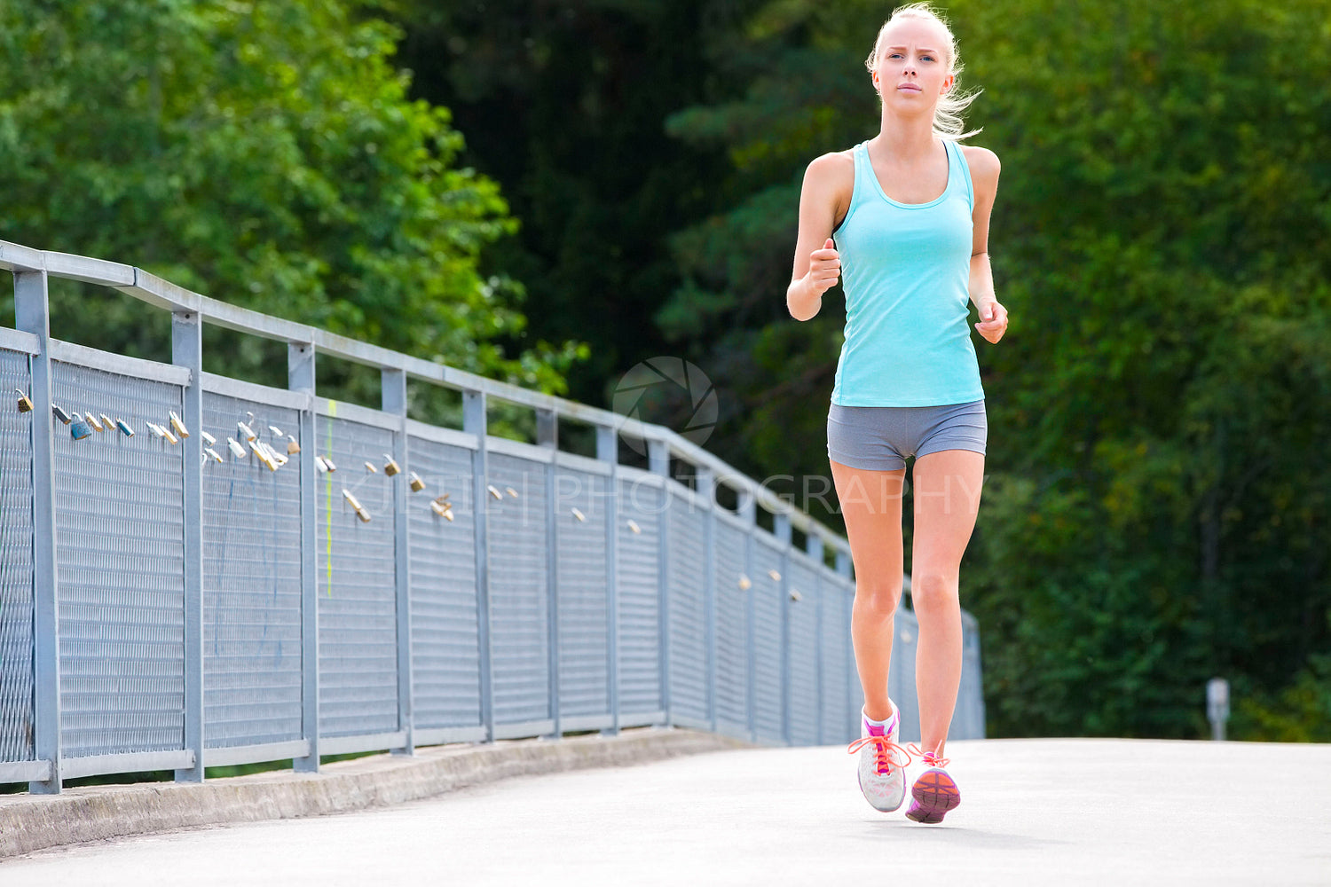 Woman runs outdoor on a bridge as stamina training