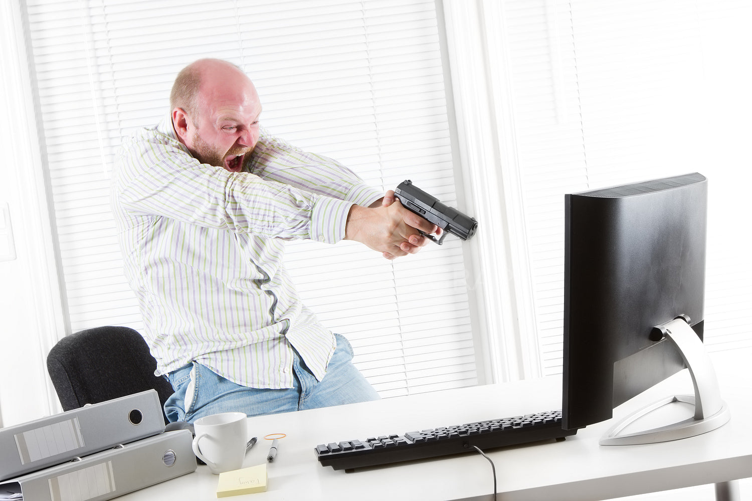Angry Businessman Threatens Computer with a Gun