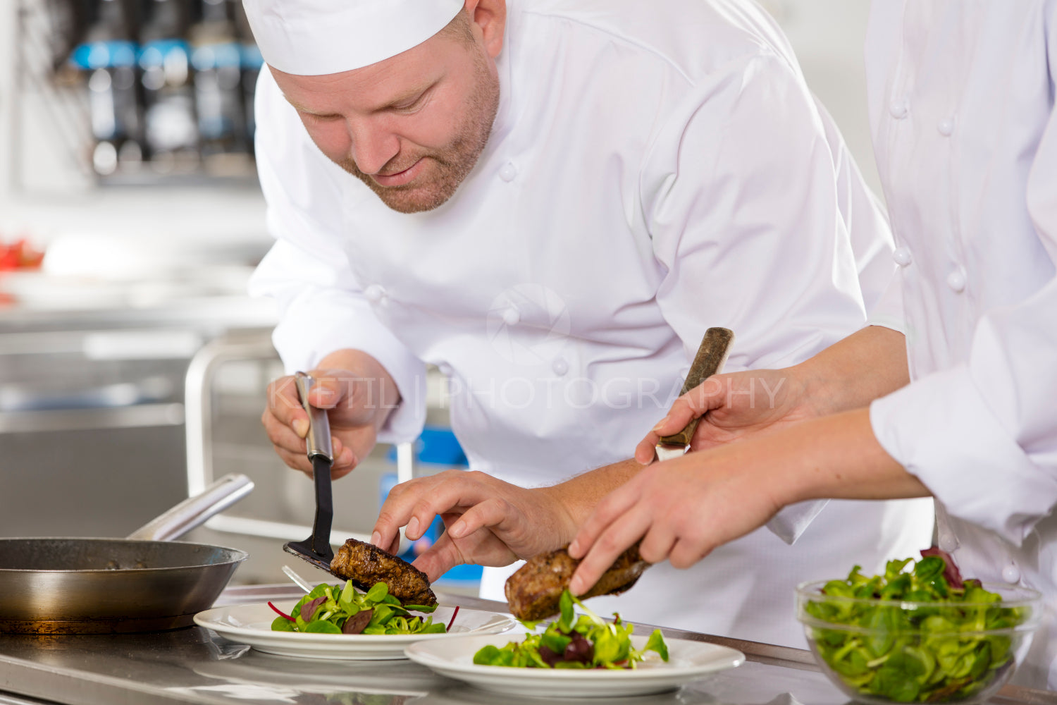 Professional chef prepare steak dish at restaurant