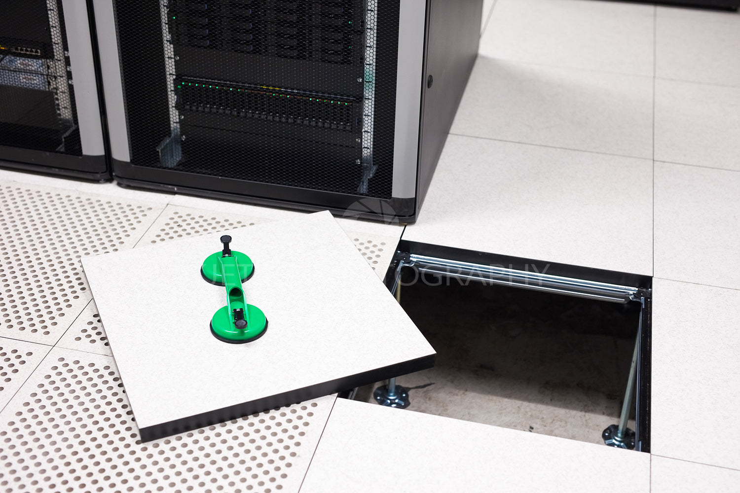 Lifted Floor Tile With Vacuum Suction Cups In Datacenter