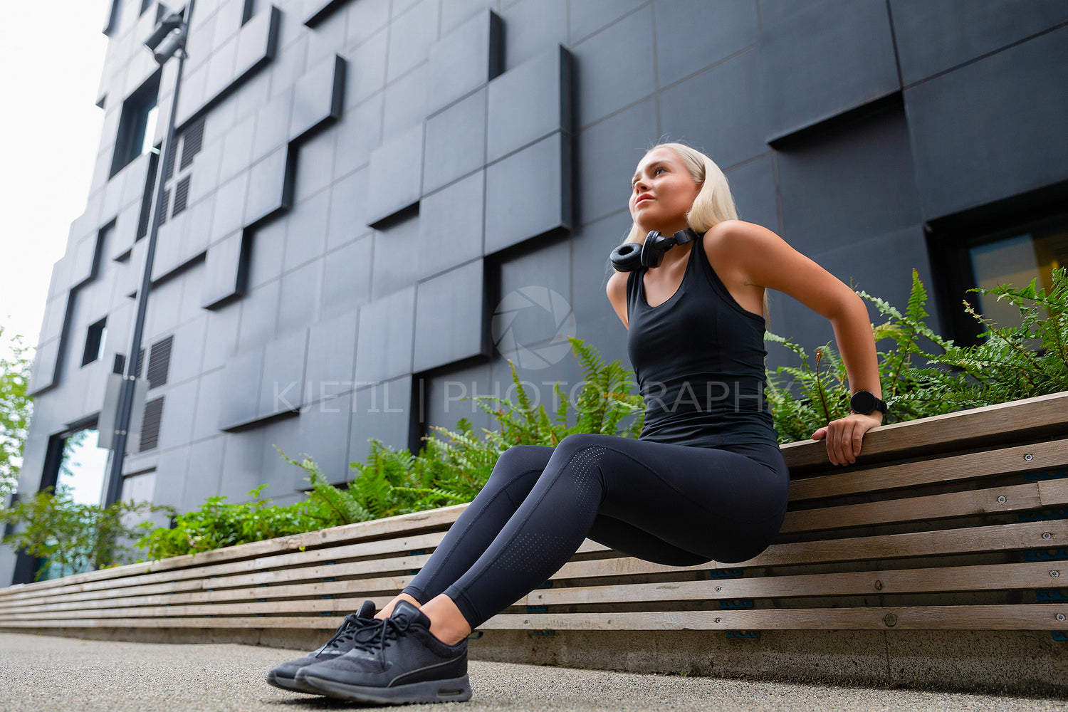 Focused Woman Doing Triceps Dips Outdoor in the City