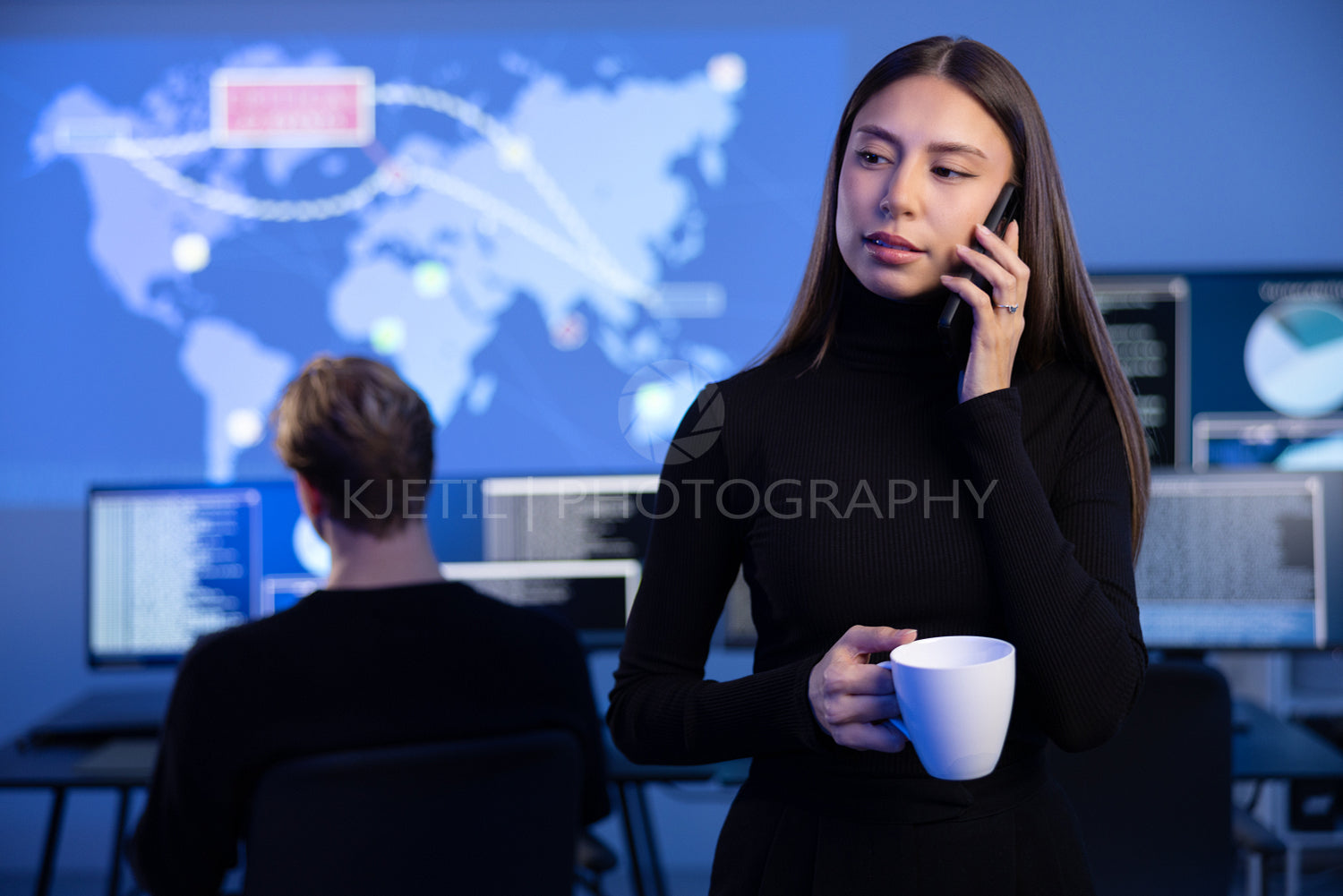 Female Cybersecurity Manager talking in the phone in Enterprise Cyber Security Operations Center SOC