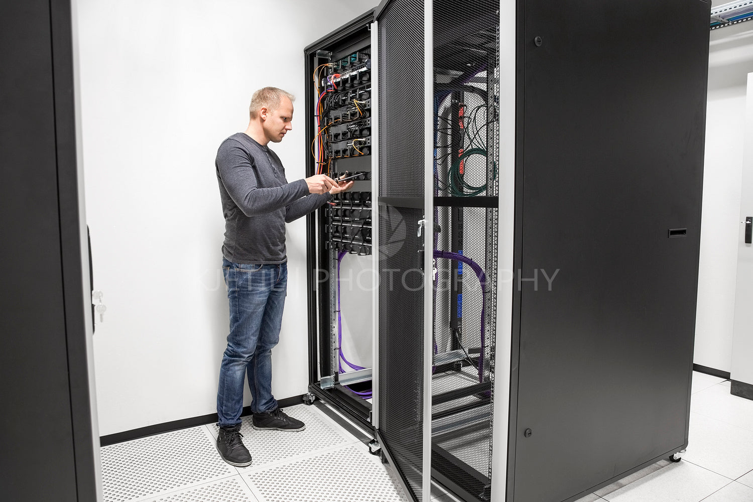 IT consultant building network rack in datacenter
