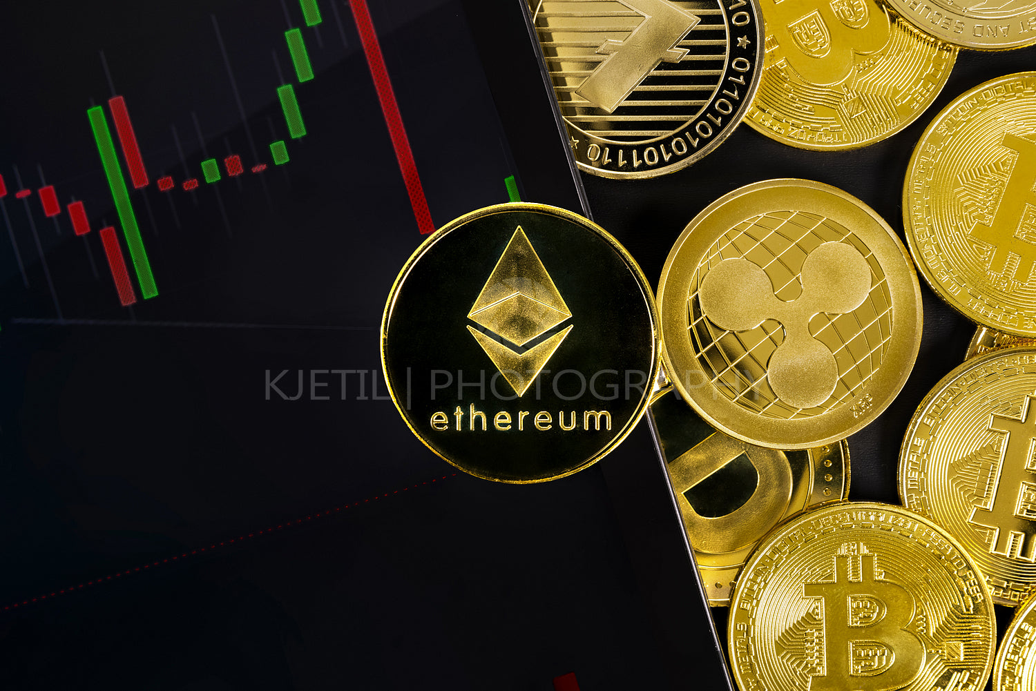 Close-up of Ethereum coin on digital tablet with graph by various coins