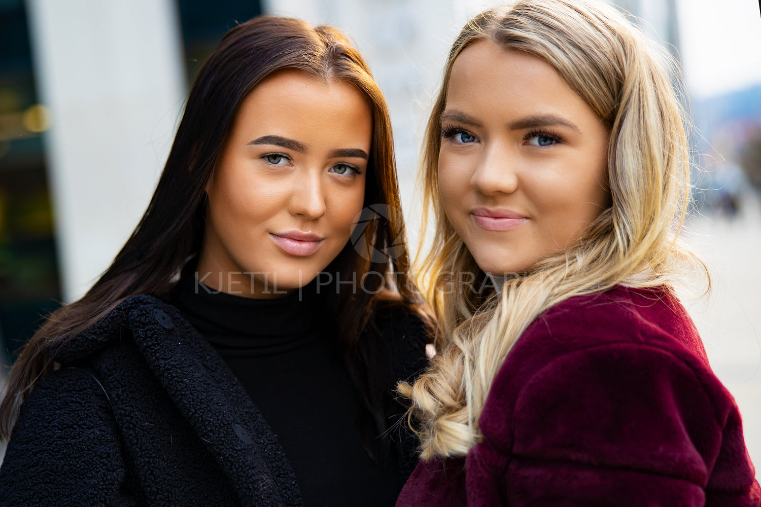 Close-up Portrait Of Smiling Beautiful Young Women Friends In City