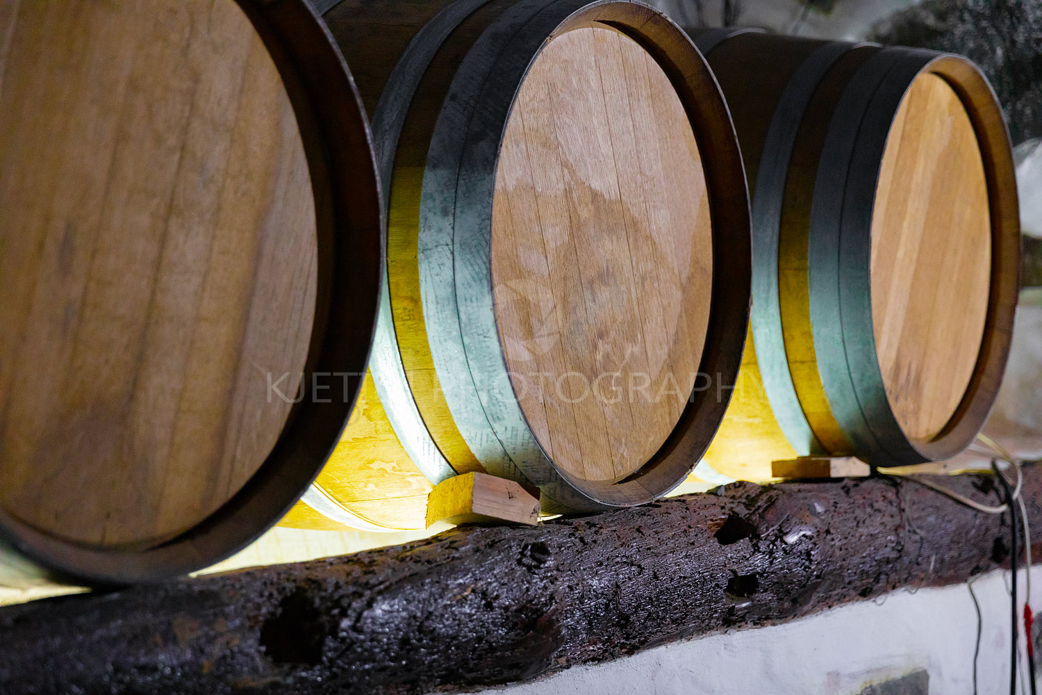 Wooden Barrels At Wine Storeroom in Cellar
