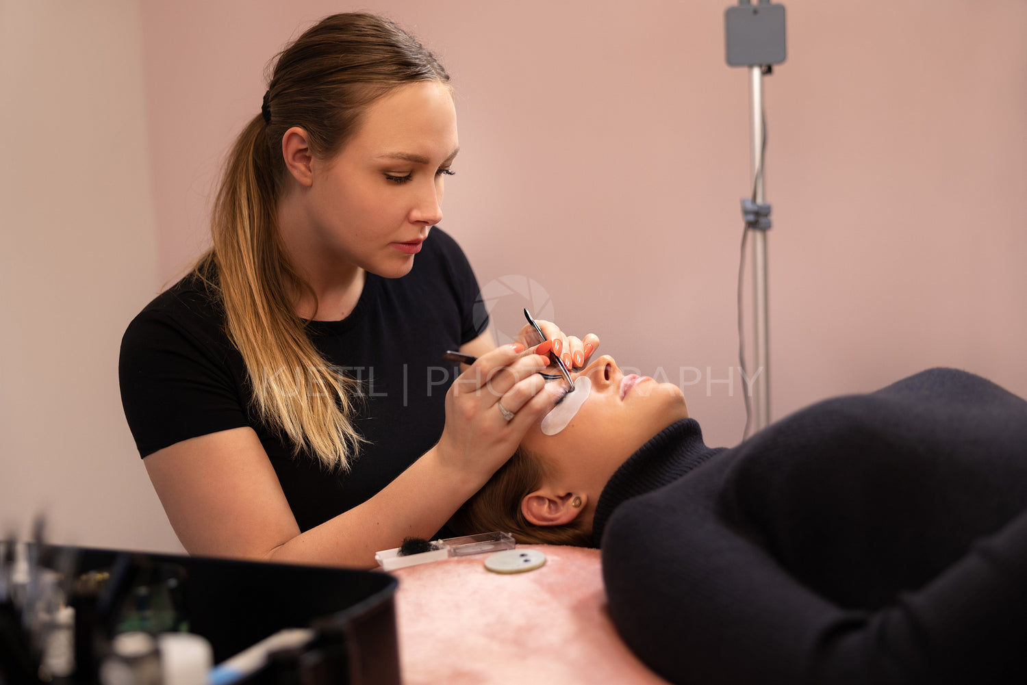 Specialist Using Tweezers During Eyelash Extension Treatment