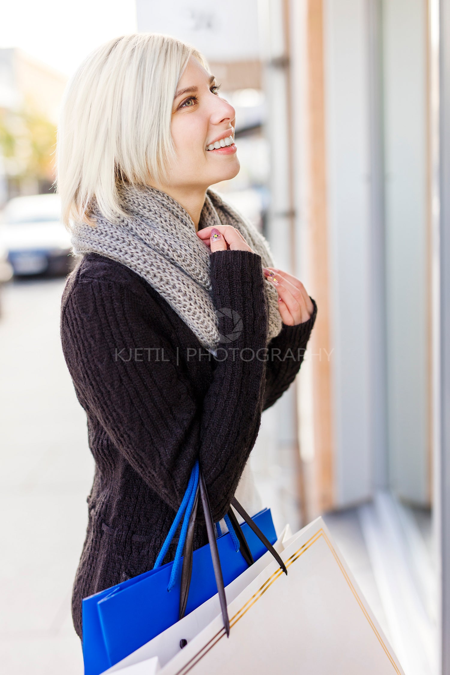 Smiling woman out shopping in the city