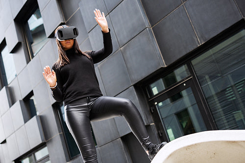 Woman Wearing Virtual Reality Glasses And Black Outfit In Futuristic City
